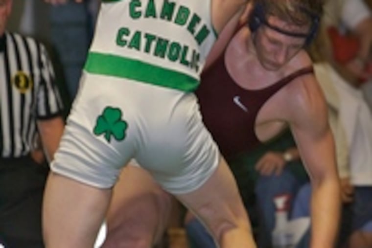 Eastern's Bob Bradis (rear) loses his footing in the 189-pound bout against Camden Catholic's William Cornely. Bradis won the bout in a 7-6 decision.