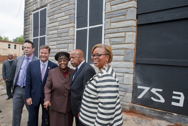 Local social activist Patrick Duff, U. S. Rep. Donald Norcross, Jeanette Lily Hunt, civil rights icon and U. S. Rep. John Lewis and former Camden Mayor Dana Redd stand in front of the Walnut Street house that Ms. Hunt owns in Camden where Rev. Dr. Martin Luther King Jr. lived while a student at Crozer Theology Seminary in the 1950s.