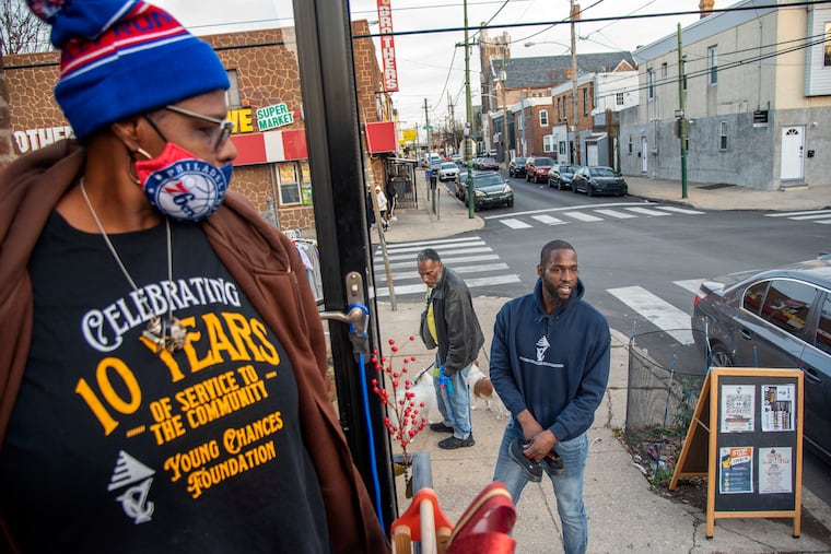 Tyrique Glasgow (right) works out of his Young Chances Foundation in South Philadelphia on Tuesday with his mother, Yvonne Glasgow. He is a finalist for the annual CNN Heroes contest.