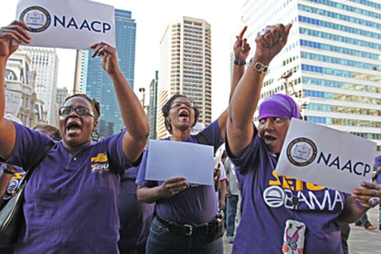 Union members (from left) Denise Sharper, Jacqueline Coles, and Karmella Sams at a rally Thursday across from City Hall, where the state Supreme Court met. (MICHAEL BRYANT / Staff)