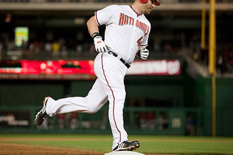 Adam Dunn rounds the bases after hitting a walk-off home run that gave the Nationals a 2-1 win. (Evan Vucci/AP)