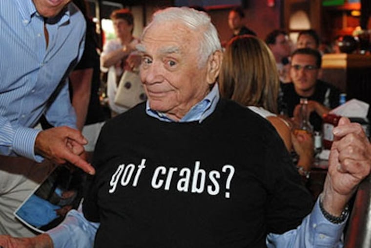 Ernest Borgnine models a T-shirt at Chickie's & Pete's restaurant in South Philadelphia in 2010. The actor and his wife, Tova, who sells beauty care products on QVC, purchased a home in in East Goshen Township in 2004. They continued to live there until he got sick recently.