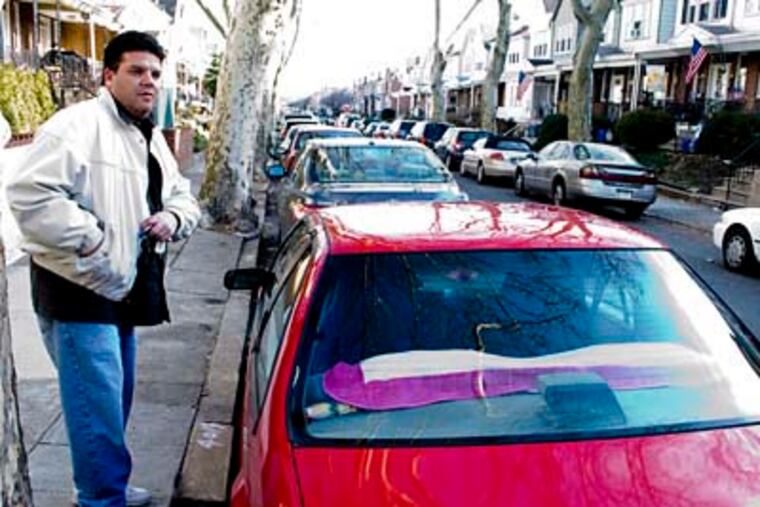 David Toledo was allegedly the victim of tire-slashing when all four tires on his Jeep Cherokee were punctured with a knife. The night before, his wife's car was attacked in the same fashion. He and other neighbors hope to form a neighborhood watch to see these attacks come to an end. Wednesday, Toledo was arrested and charged with 47 counts of criminal mischief. ( Richard Kauffman / Staff Photographer )