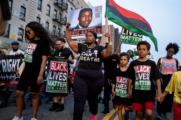 Activists with Black Lives Matter protest in Harlem in 2019 after federal prosecutors declined to bring civil rights charges against New York City Police Officer Daniel Pantaleo in the 2014 chokehold death of Eric Garner. The decision was made by Attorney General William Barr and announced one day before the five-year anniversary of Garner's death.