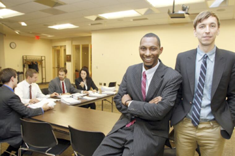 Expungement Project leaders Ryan Hancock (right) and Mike Lee at a meeting with lawyers. (Yong Kim / Staff Photographer)