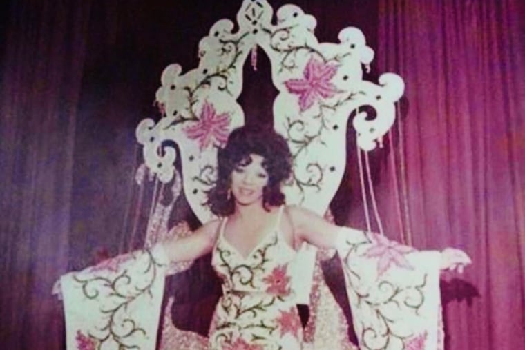 Les Harrison performing in one of the elaborate costumes he made himself.