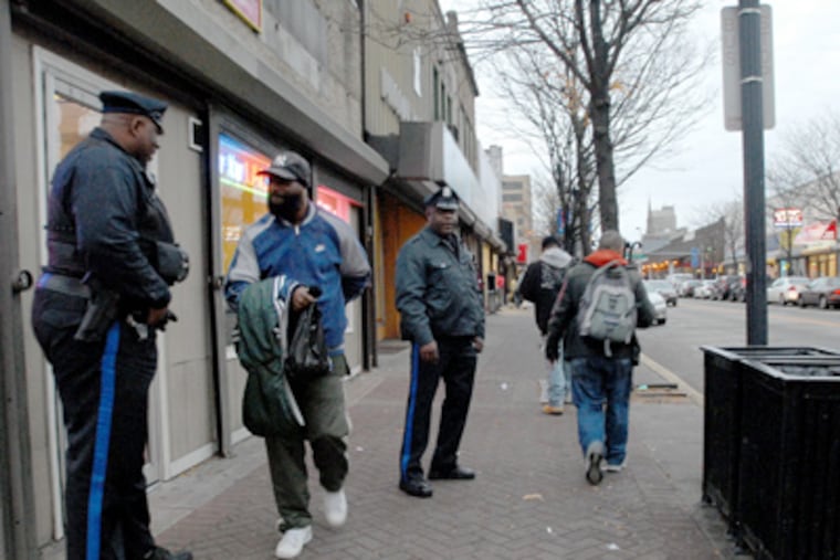 Camden officers on patrol on Broadway near Stevens Street. (April Saul / Staff Photographer)