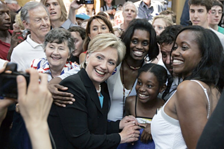 Sen. Hillary Rodham Clinton, D-N.Y, poses for a picture with supporters Saturday at the National Building Museum in Washington after she suspended her campaign for president. (AP Photo/Susan Walsh)