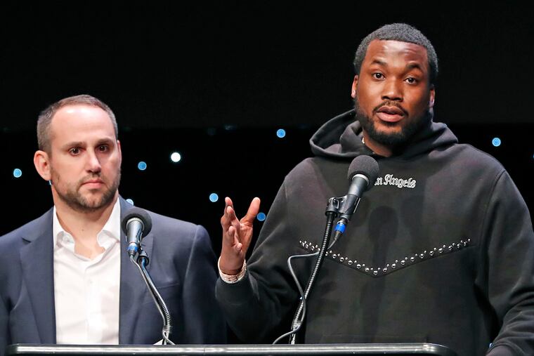 Meek Mill (right) speaks about his incarceration, along with former Philadelphia 76ers co-owner Michael Rubin, at the launch of REFORM Alliance in New York on Jan. 23, 2019.