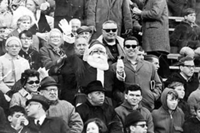 Frank Olivo playing Santa at an Eagles game in 1967. He was pelted with snowballs the next year.