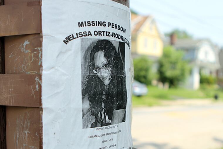 A missing-person poster at the site where police searched for the body of Melissa Ortiz-Rodriguez, in Collingdale in June 2013. She remains missing. (Stephanie Aaronson/Staff Photographer)