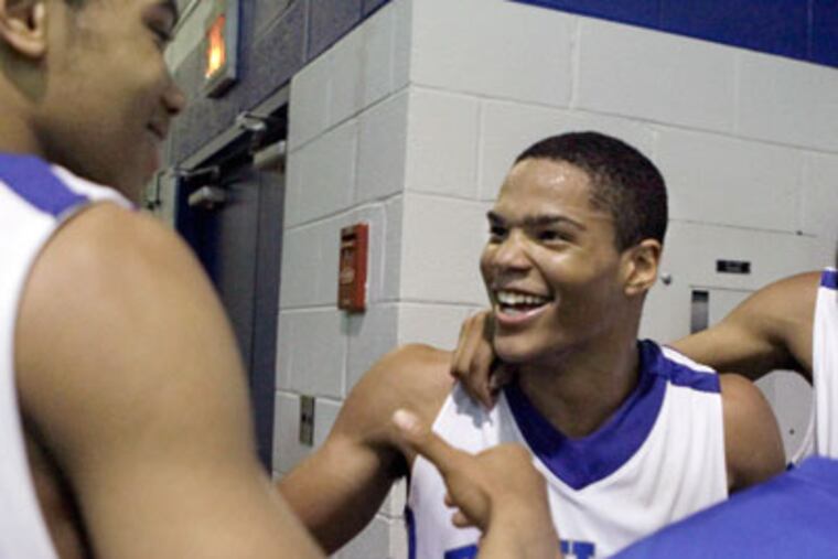 Paul VI's Kris O'Connor celebrates with other teammates. (Elizabeth Robertson / Staff
Photographer)
