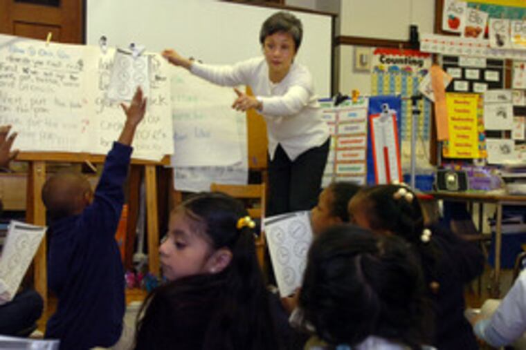 Margarita Wilson, a teacher at Nebinger Elementary School in Phila.'s Bella Vista section, is credited by administrators with sparking academic improvement.
