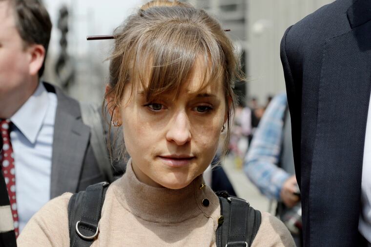 Allison Mack leaves federal court on April 8, 2019, after pleading guilty to racketeering charges in a case involving a cult-like group based in upstate New York called NXIVM.