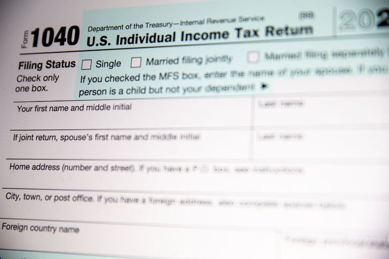 A 1040 tax form is pictured. The tax-filing deadline is April 15.