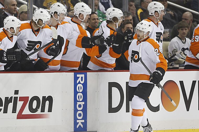 Matt Read celebrates a short-handed goal against the Penguins during the second period on Sunday, March 16, 2014, in Pittsburgh. (Keith Srakocic/AP)