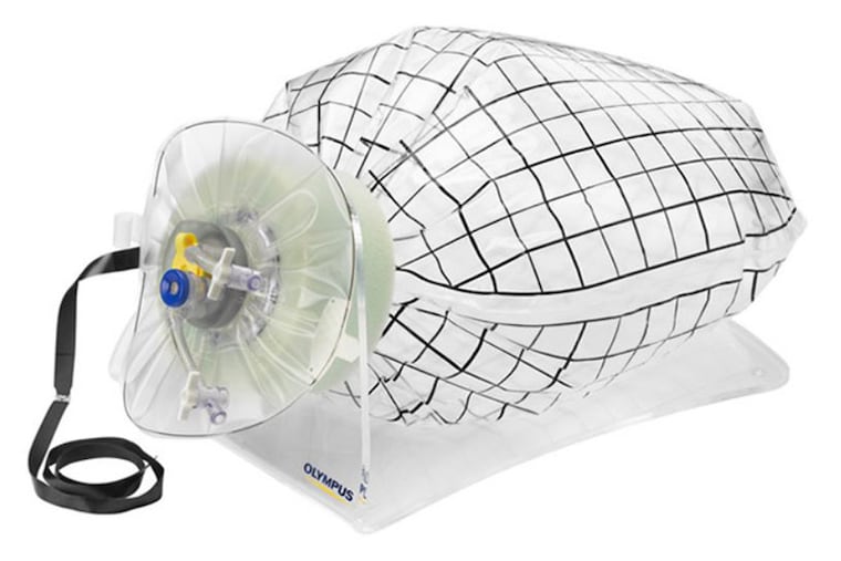 Olympus America Inc's new tissue-containment bag is put in the abdomen during gynecological surgery. It attaches to a tissue-cutting device.