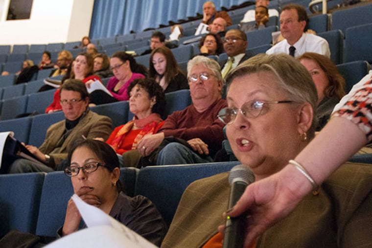 Sharon K. Barker, Assoc. Director of Housing and Community Development Network of New Jersey, reads a statement during the public hearing on the Christie administration's plan to spend the next $1.46 billion in federal Sandy aid, held at Richard Stockton College Performing Arts Center, February 11, 2014. ( DAVID M WARREN / Staff Photographer )