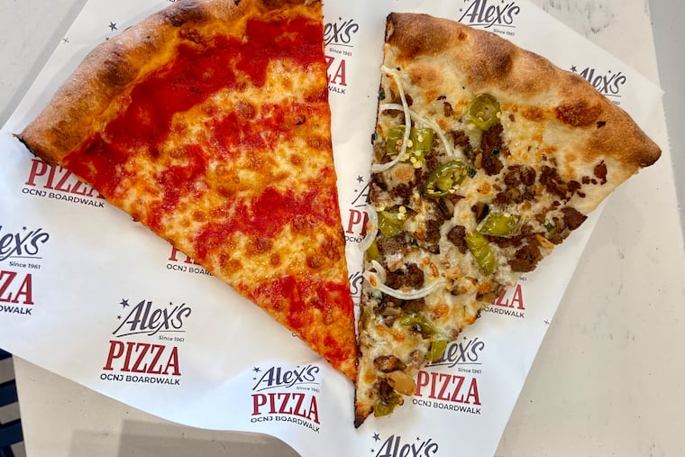 Two slices of pizza, one with simply sauce and cheese, another with sausage and long hots, is served at the new boardwalk location in Ocean City for Alex's Pizza from Roxborough.