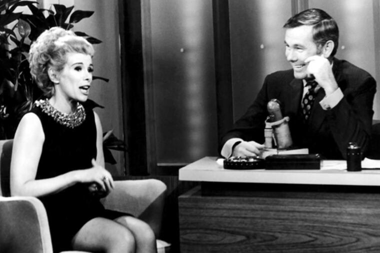 Joan Rivers with "Tonight Show" host Johnny Carson. After a breakthrough appearance on the show in '65, she became a regular guest and later the permanent guest host, before the two had a falling-out over her Fox show.