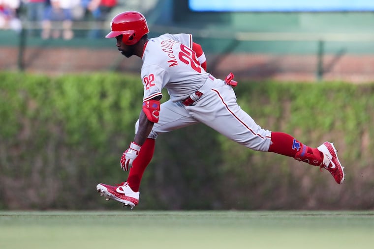 Phillies outfielder Andrew McCutchen, pictured in a game against the Chicago Cubs back on May 22, left Monday night's game against San Diego with a knee injury.