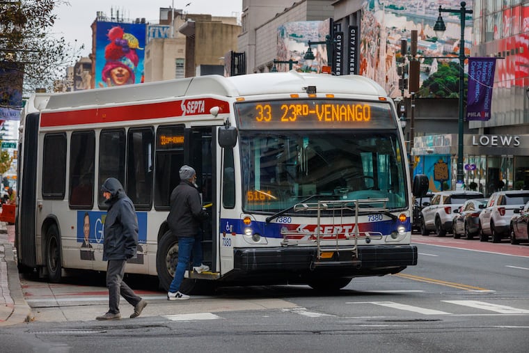SEPTA 33 bus picking up passengers at 13th and Market Street, Center City Philadelphia, in December.
