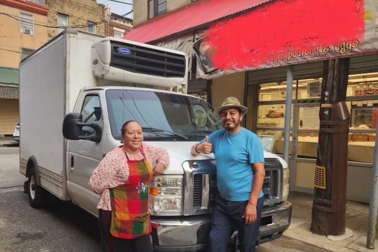 Husband and wife team Alma Romero and Marcos Tlacopilco of South Philadelphia's Alma Del Mar and Marcos' Fish and Crab House restaurants stand with their replacement refrigerated truck. Their first truck was stolen. A GoFundMe campaign attracted over 300 donors and which helped them purchase a replacement.