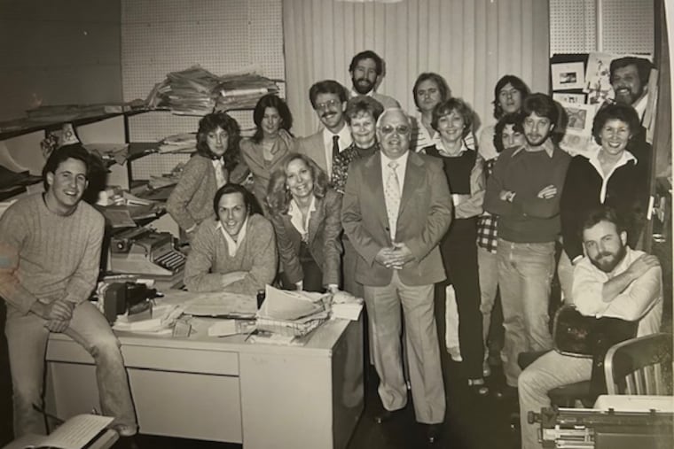 The Sun staff in the early days of the paper, a mix of reporters, production people, and ad sales reps. The publisher, Geoffrey Douglas is seated at the desk.