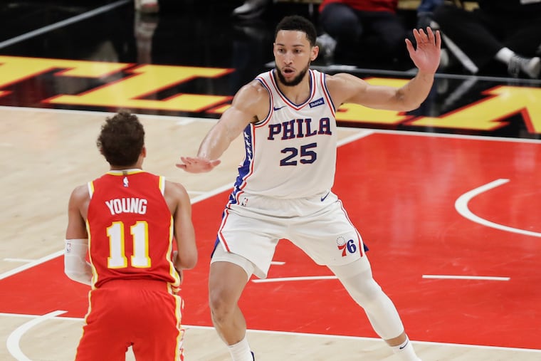 Sixers guard Ben Simmons defends Atlanta Hawks guard Trae Young in Game 3 of the NBA Eastern Conference playoff semifinals on Friday, June 11, 2021 in Atlanta.