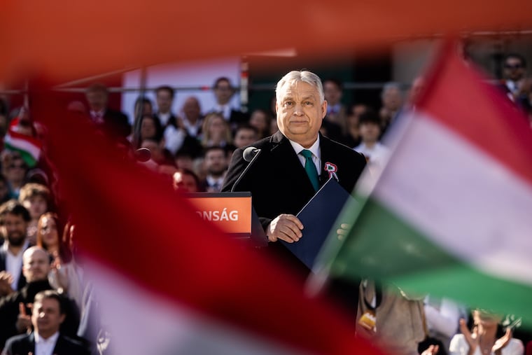 Hungarian Prime Minister Viktor Orban appears at a rally ahead of the general election in Budapest, on March 15.