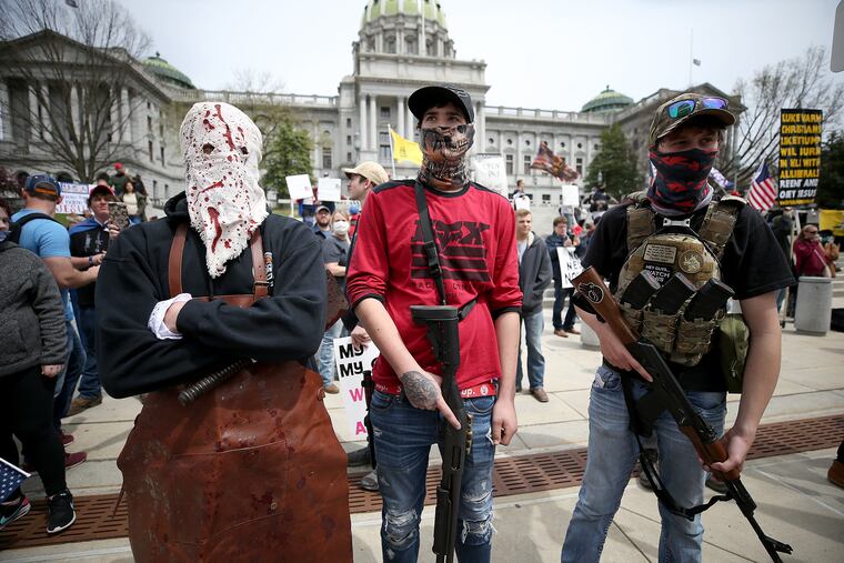 Protesters and militia gather outside the Capital Complex in Harrisburg on Monday, calling for Gov. Tom Wolf to reopen the state's economy.