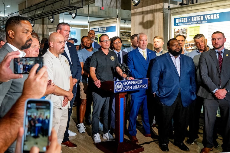 Gov. Josh Shapiro visits SEPTA headquarters on Sunday, Aug. 10, 2025, to discuss funding for the transit agency and to pressure Senate Republicans, as planned service cuts are pending because of a budget shortfall. Scott Sauer, SEPTA's general manager, is fourth from left, joined by union workers and state Democratic legislators.