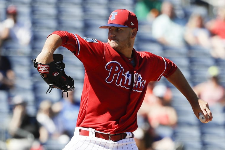 Cole Irvin pitching for the Phillies during spring training.