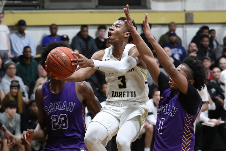 Hakim Byrd (center) of Neumann-Goretti, shown here in a game vs. Roman Catholic, will lead the Saints into Friday night's game vs. Archbishop Wood.