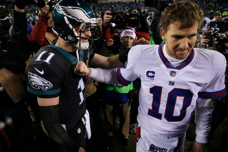 Carson Wentz and Eli Manning during the 2016 season.