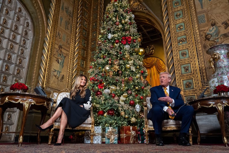 President Donald Trump, speaks accompanied by first lady Melania Trump, during a NORAD, North American Aerospace Defense Command, Tracks Santa Operation call at his Mar-a-Lago club, Wednesday, Dec. 24, 2025, in Palm Beach, Fla. (AP Photo/Alex Brandon)