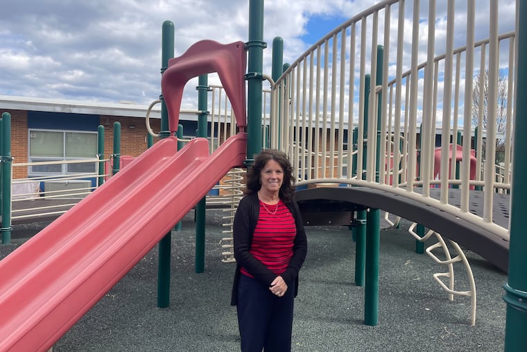 Jane Gaudreau stands in front of the playground at Archbishop Damiano School in Westville, N.J.
