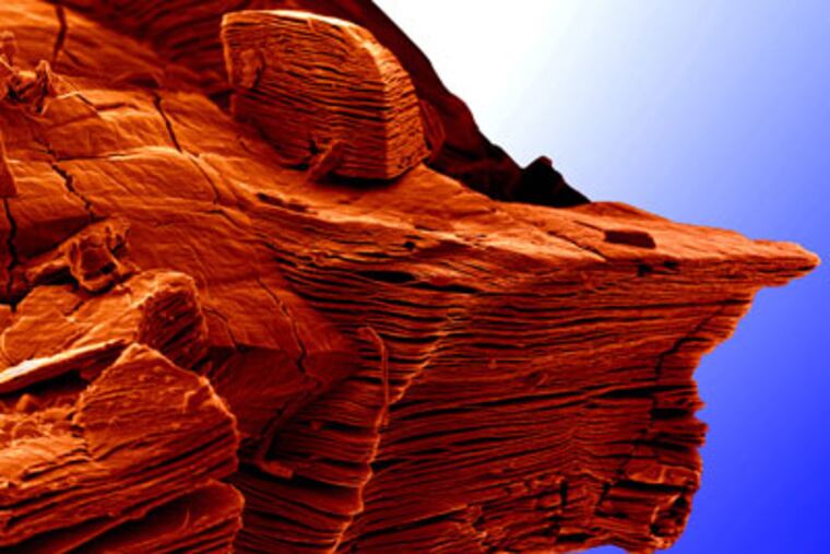 HS1NANO13-a - This photo depicts a new kind of material called an MXene (the first two letters are capitalized), which is made of “nanosheets†that are thousands of times thinner than a human hair. Drexel University engineer Babak Anasori took this photo with an electron microscope and added color, giving it the appearance of a rocky crag in the American West. The photo won a People’s Choice award in a photo contest sponsored by the National Science Foundation and Science magazine.
Credit: Babak Anasori, Michael Naguib, Yury Gogotsi and Michel Barsoum, Drexel University