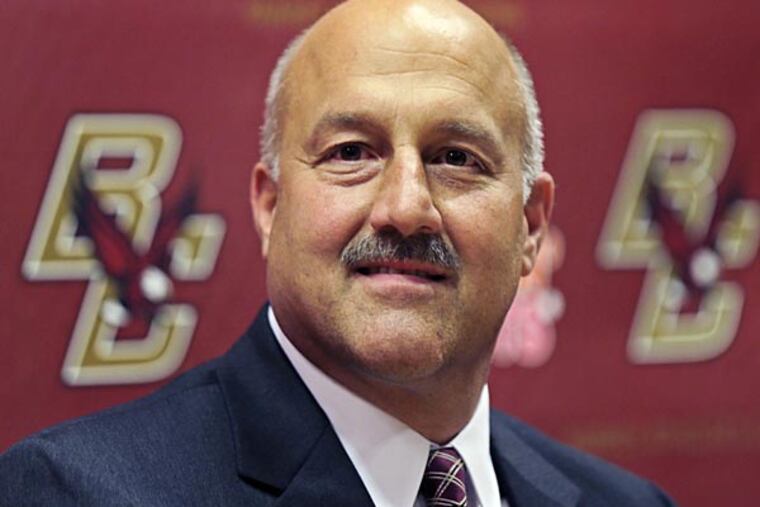 Steve Addazio smiles during a news conference where he was introduced as the new football head coach for Boston College in Boston, Wednesday, Dec. 5, 2012. Addazio, a Connecticut native, was hired to replace Frank Spaziani. He takes over a program that finished last in the Atlantic Coast Conference last season. (AP Photo/Charles Krupa)