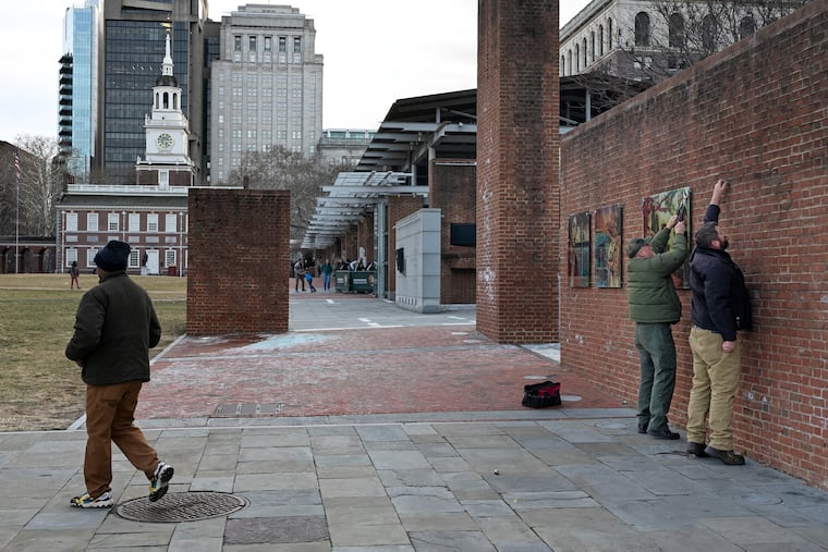 National Park Service workers remove displays at the President’s House site in Independence National Historical Park on Thursday.
