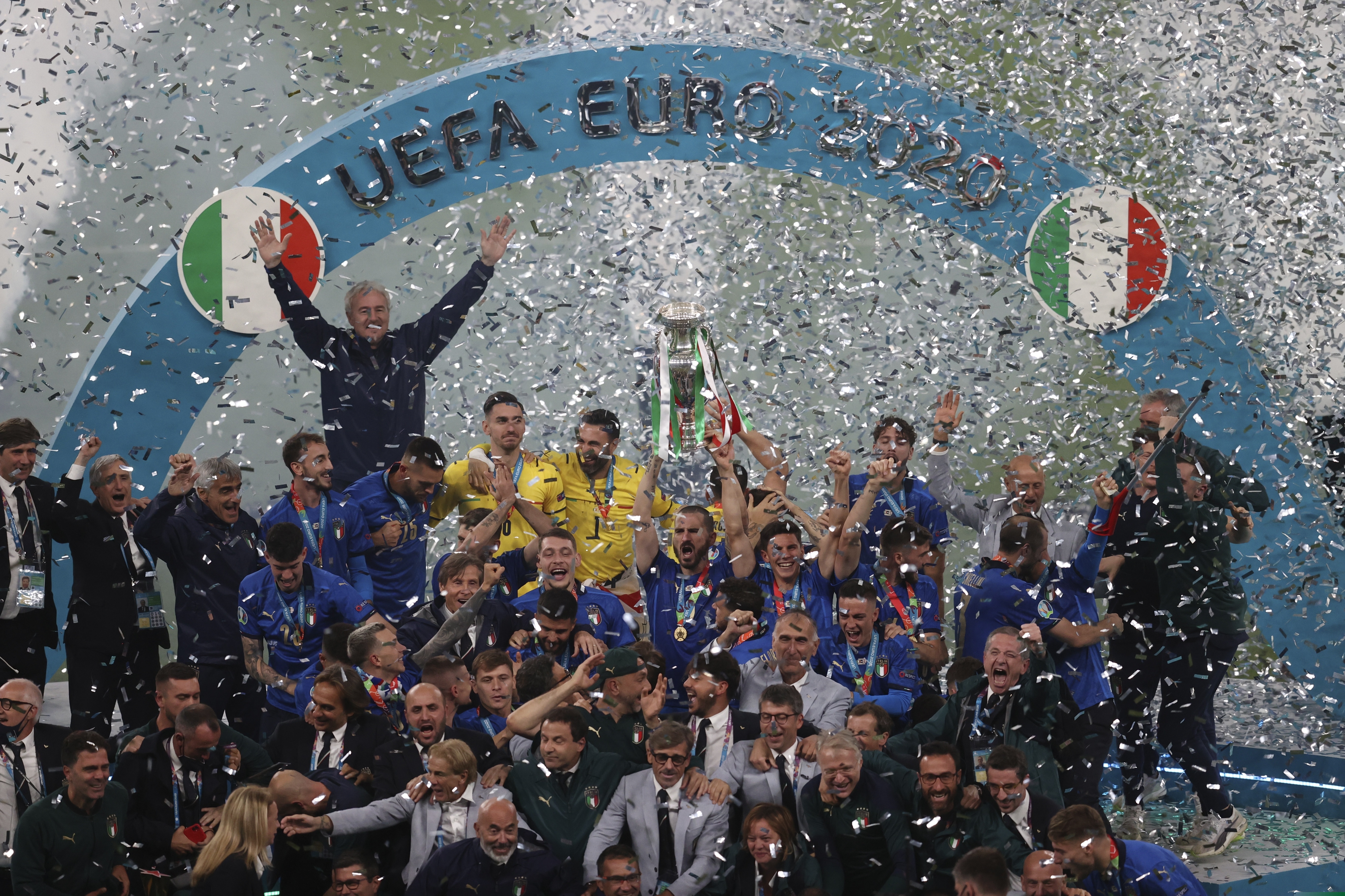 Italian team celebrates with the trophy after the Euro 2020 soccer final match between England and Italy at Wembley stadium in London, Sunday, July 11, 2021.