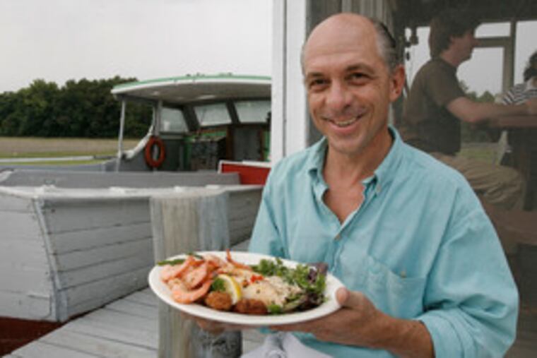 Owner Kenny Lore with stuffed flounder with shrimp, at Bull on the Barn restaurant in Newport, N.J. The Lores have oystered and clammed since colonial times, and Kenny's seafood is still local.