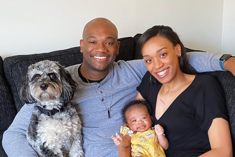 Anthony and Brielle with Ellara Rayne and the family's Cavapoo, Willie,