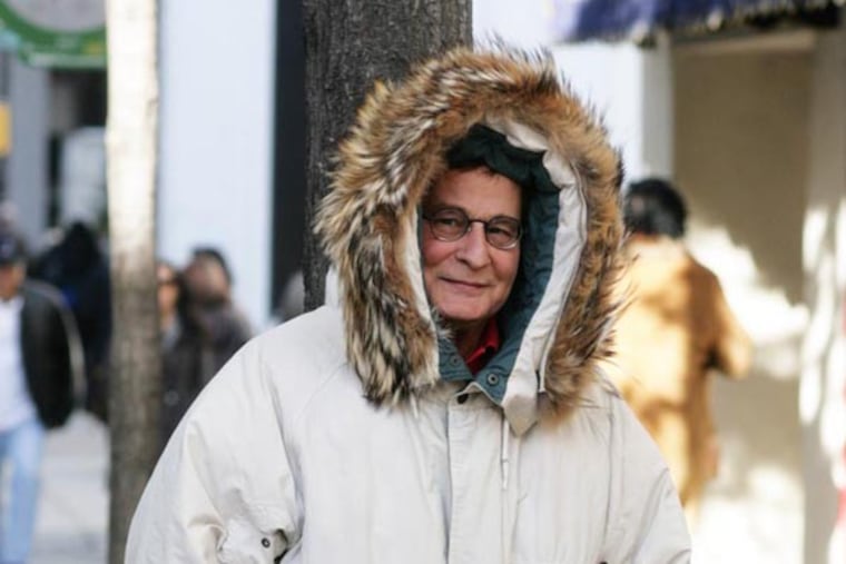 Winter coats are in full effect as locals opt for varying cold weather fashions from puffy parkas to classic peacoats. (Reuben Harley / Philly.com)