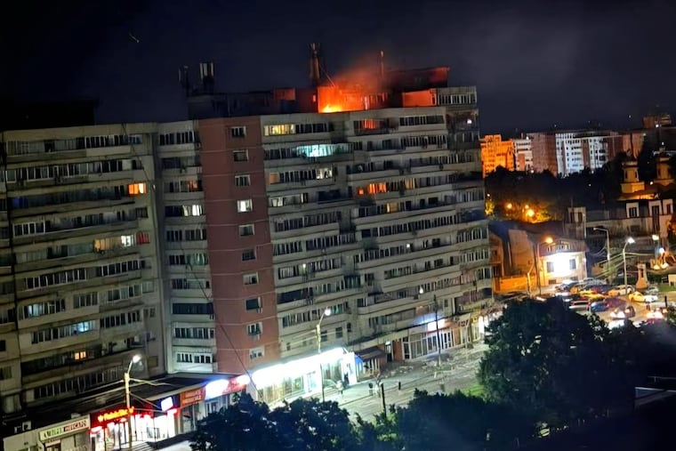 A fire burns on top of a block of flats after a drone crash caused an explosion on impact, in Galati, eastern Romania near the Ukrainian border, Friday May 29, 2026.