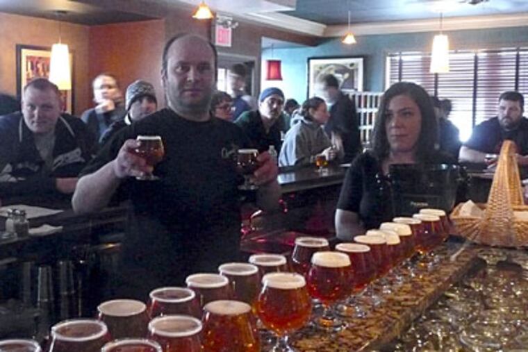 Matt Capone serves Pliny the Younger beer at Capone's.