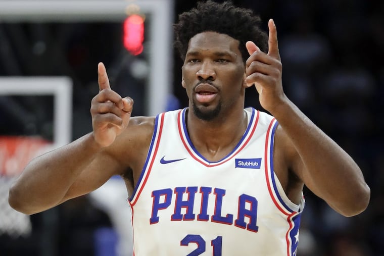 Sixers’ center Joel Embiid (21) celebrates an and-1 call during the Sixers’ win.