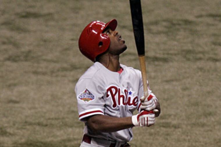 Jimmy Rollins pops up to start the first inning of World Series Game Two at Tropicana Field last night. ( Michael Perez / Staff Photographer )