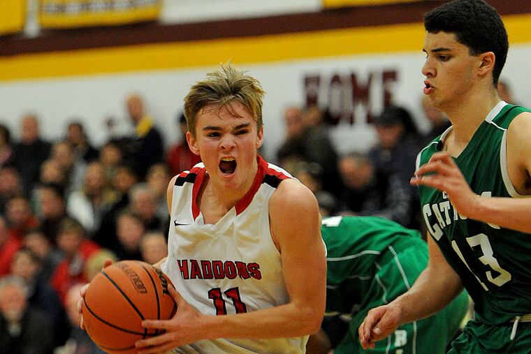 Haddonfield's Matt Fell drives to the basket past Camden Catholic's
Dominic Dunn.