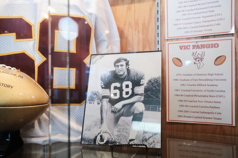 A small nod to Eagles defensive coordinator Vic Fangio hangs in the trophy case among other memorabilia in Dunmore High School.